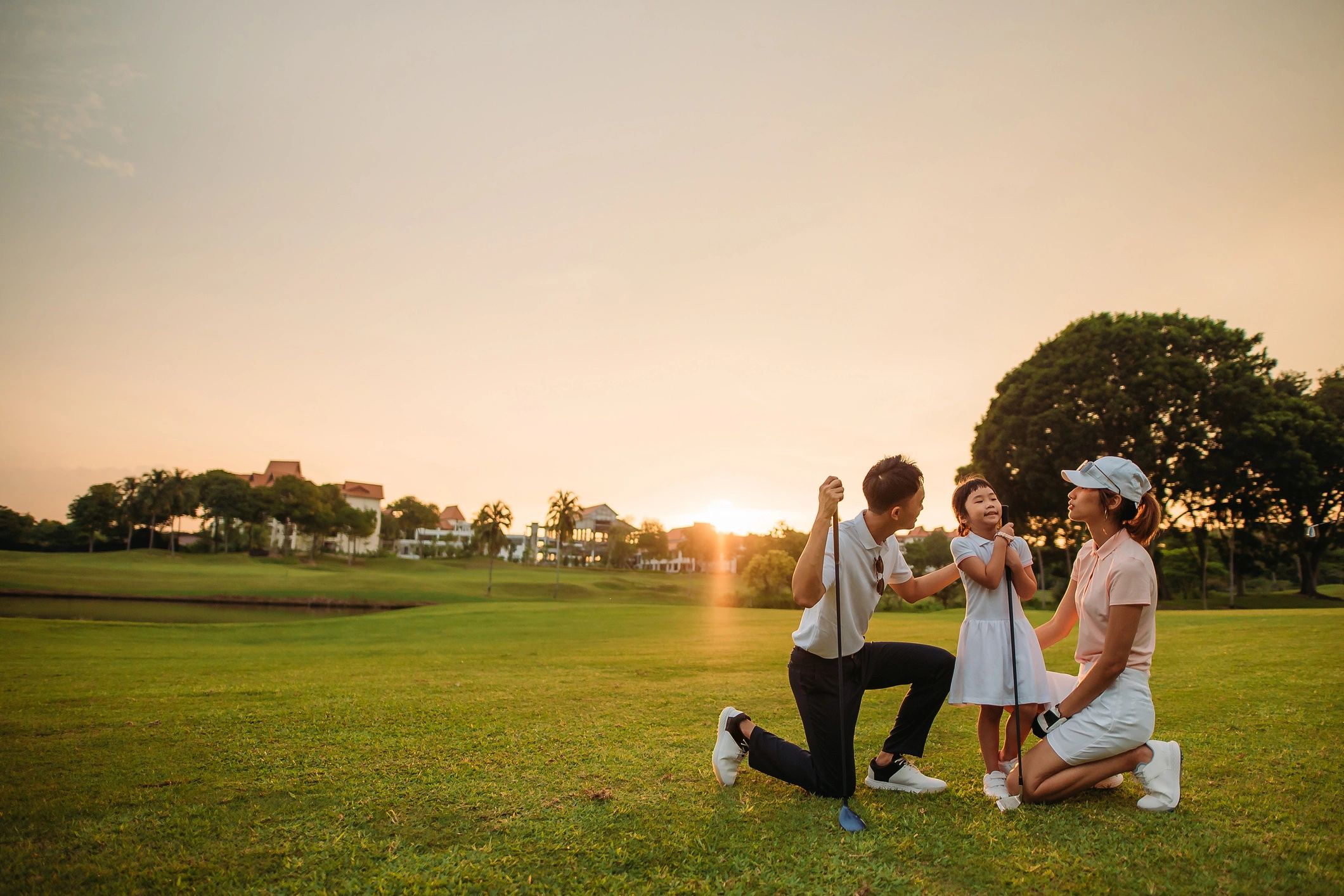 Family spending time together outdoors at sunset