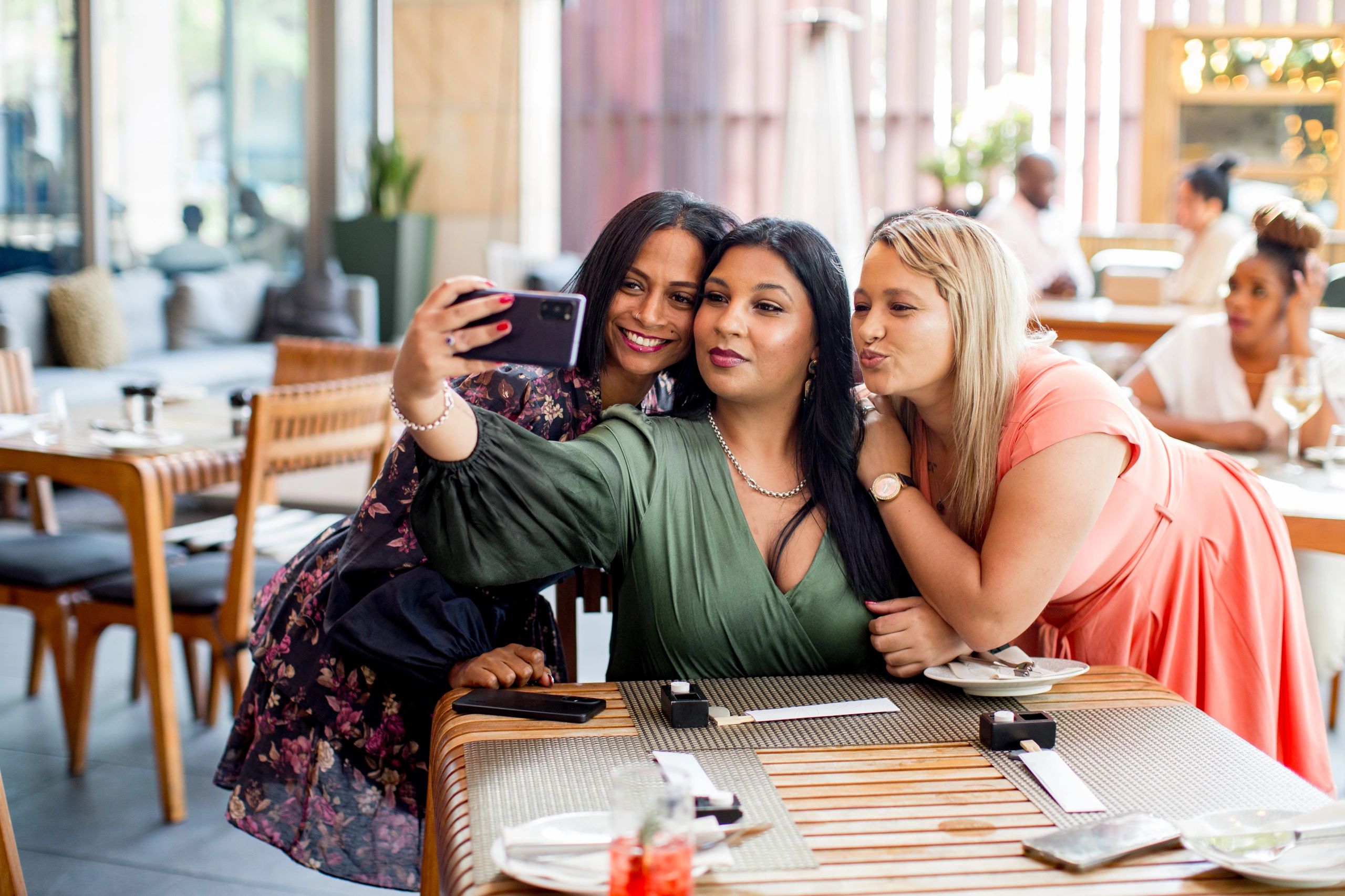 Friends celebrating at elegant restaurant table