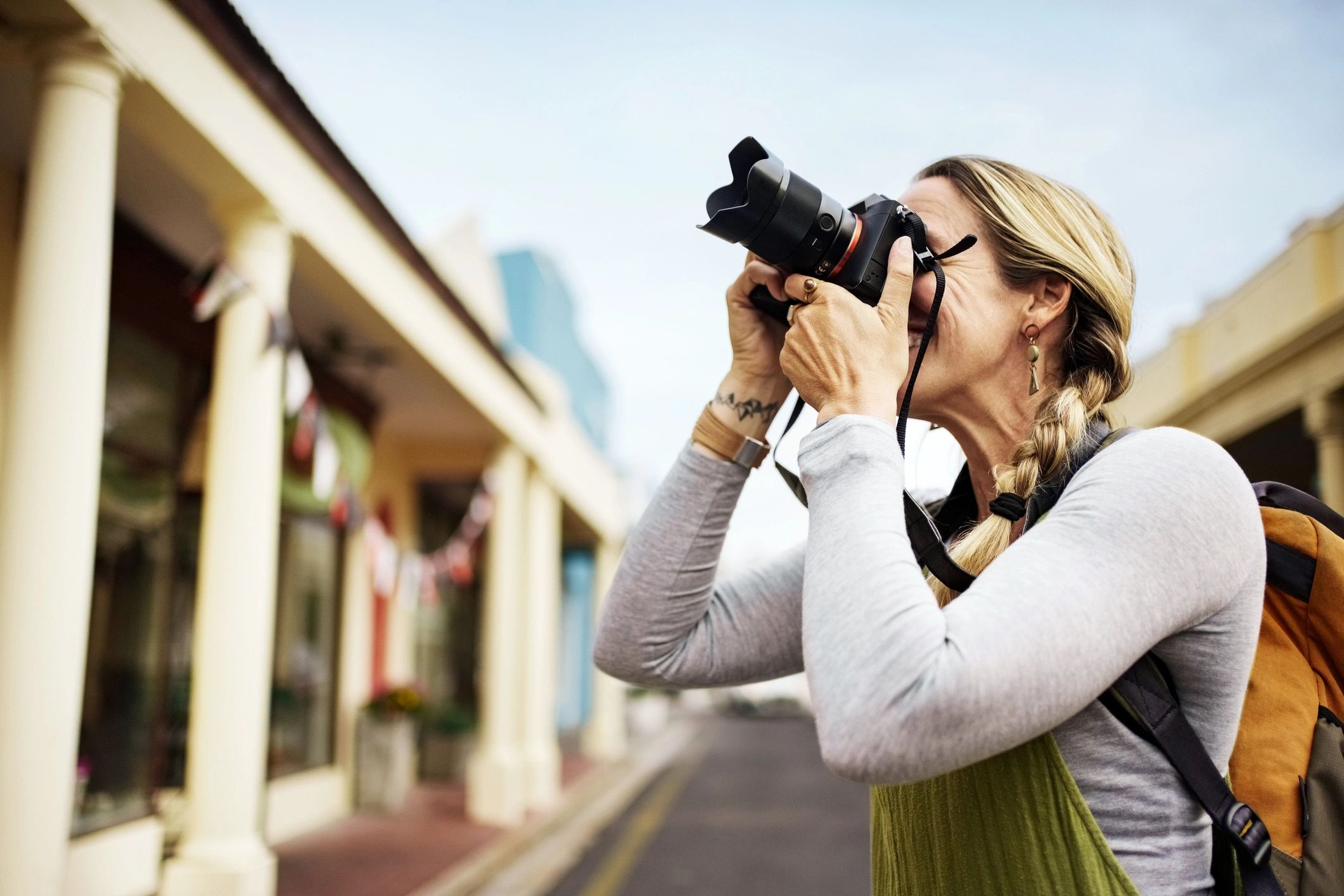 Photographer capturing a city scene