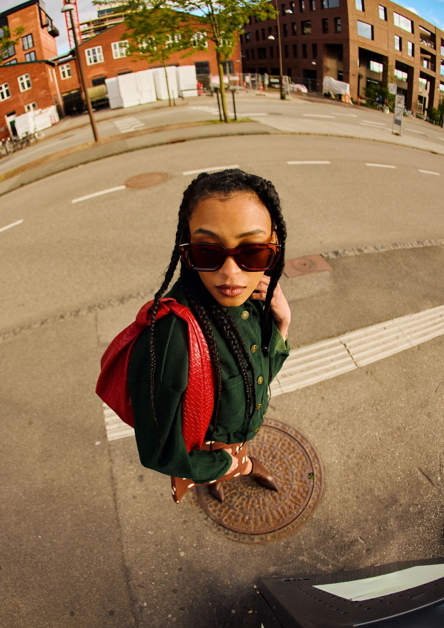 Stylish woman walking through a city street