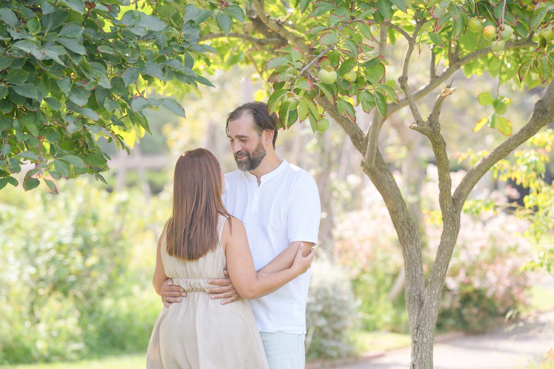 Couple sharing a warm embrace outdoors