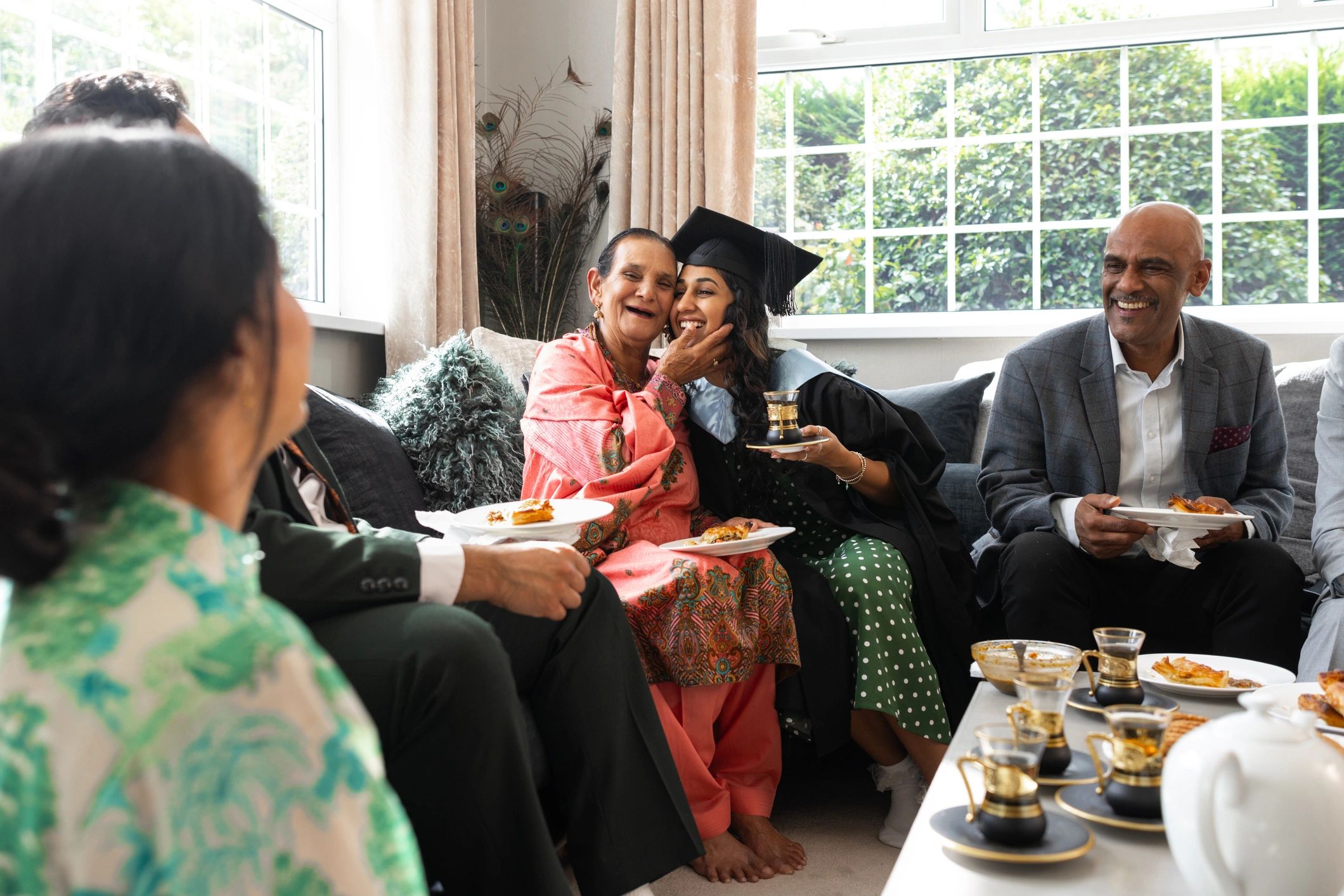 Family members hugging in a bright living room