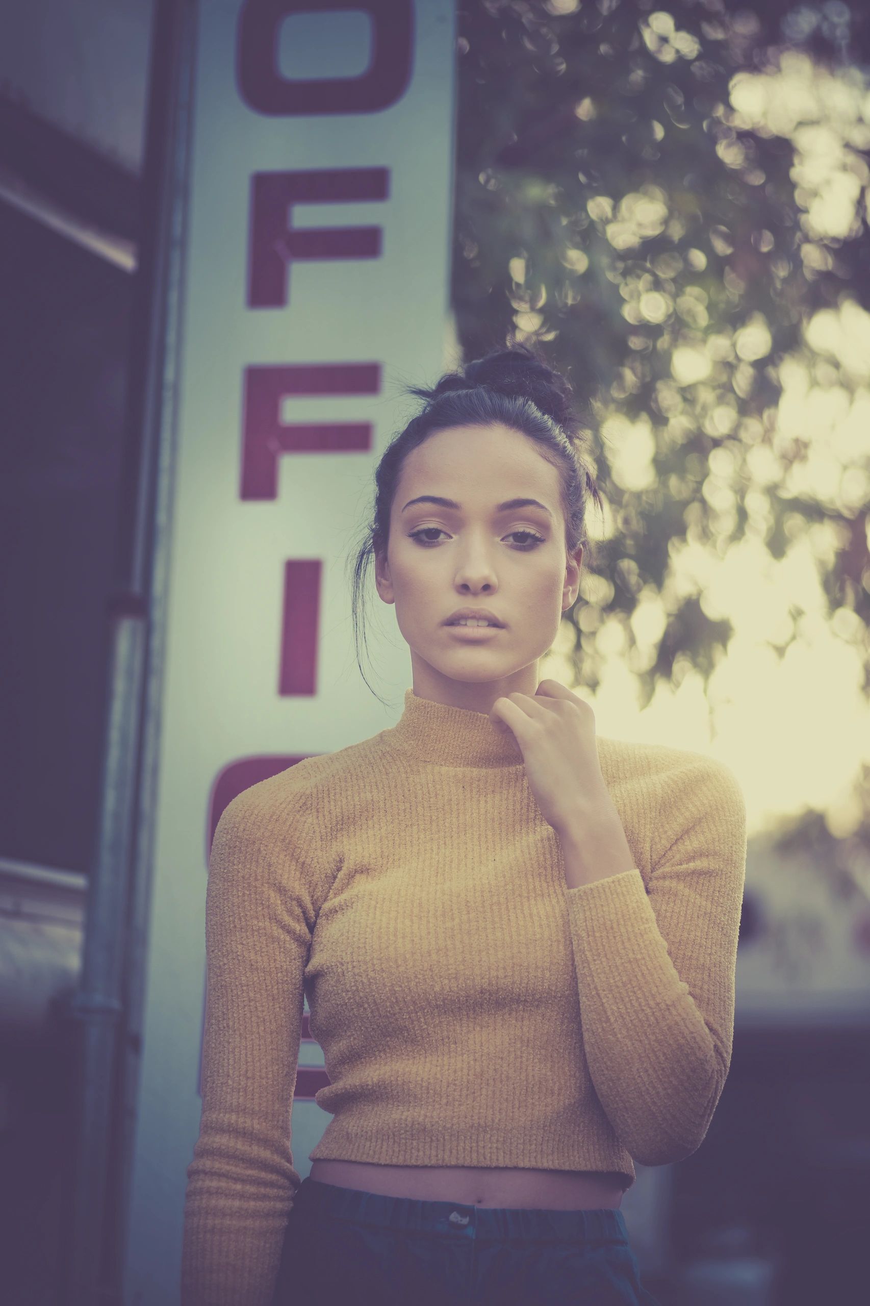 Fashion portrait of a young woman in warm light